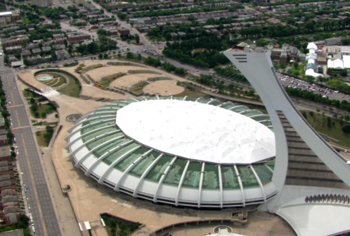 Flying over Olympic Stadium to view of Montreal, Quebec. Shot in 2003.