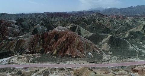 Drone flight over the colorful rainbow mountains of Zhangye danxia landform geological park in Gansu province, China, May 2017