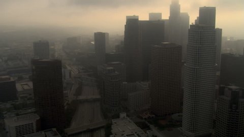Orbiting downtown Los Angeles with smog and overcast skies. Shot in 2008.