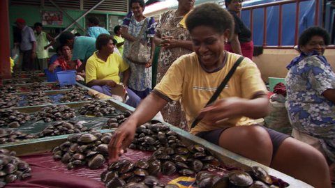 Seafood vendor at a marketplace in Fiji