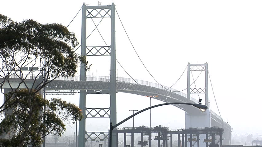 This is a shot of a traffic filled bridge in light foggy weather.  Shot with an