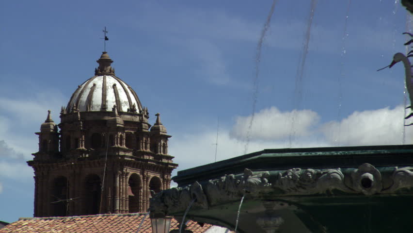 Fountain and Church of La Compania in the Plaza de Armas in Cusco, Peru