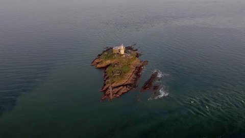 Drone view of the iconic the Mumbles lighthouse structure in Swansea Bay, Gower, South Wales, UK