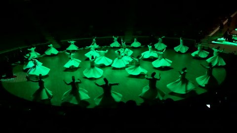 TURKEY, KONYA MARCH 18, 2016 - Sufi whirling dervish (Semazen) dances at konya. Semazen conveys God's spiritual gift to those are witnessing ritual.He spins with the music.