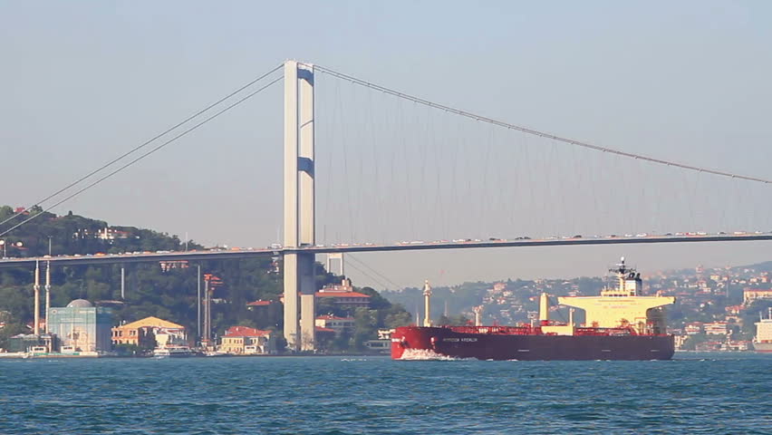 Super tanker with full of load sails under the bridge. Istanbul, Turkey
