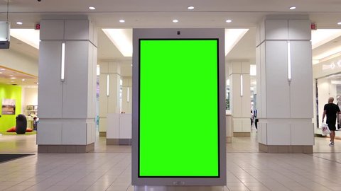 Burnaby, BC, Canada - May 04, 2017 : Motion of people shopping and green screen billboard in the middle inside Burnaby shopping mall with 4k resolution