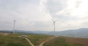Aerial drone view on Wind Turbine, Windmill, Energy Production in mountains