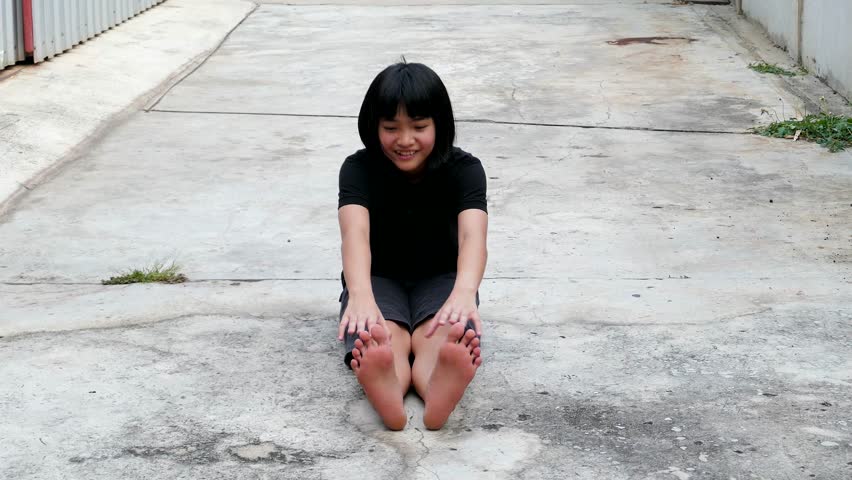 Asian girl warm up before exercise.