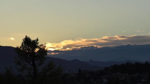 sunrise behind hills - time lapse
