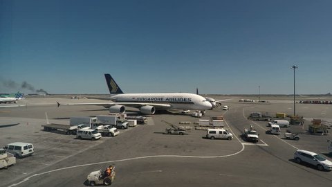 New York, USA - April 18 2017: Singapore Airlines Airbus A380-800 on JFK airport.
John F. Kennedy Airport terminal window view of Singapore Airlines airplane parked on the runway.