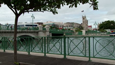 The Careenage marina with Chamberlain Bridge and Parliament Building in Bridgetown, Barbados.