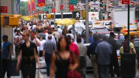 Time-lapse view of crowds and traffic on street near Rockefeller Center, NYC