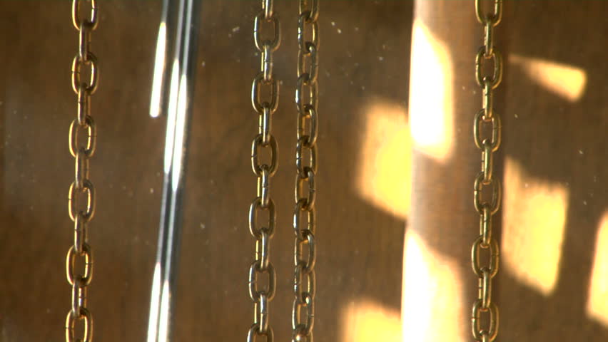 close up shot of the mechanics of a grand father clock