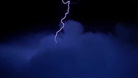 Lightning effects striking down into blue clouds