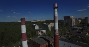 Aerial drone video with view of stadium area of Moscow Kuntsevo district, sports fields and buildings, power station chimneys, old houses and surroundings in western side of the capital of Russia
