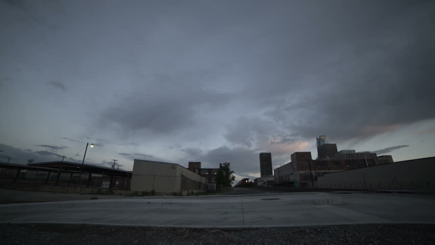 Train intersection on a cloudy sunset