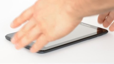 Young man hand takes tablet pc from white isolated background. 