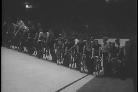 1950s: An indoor bicycling competition takes place in the 1950s.