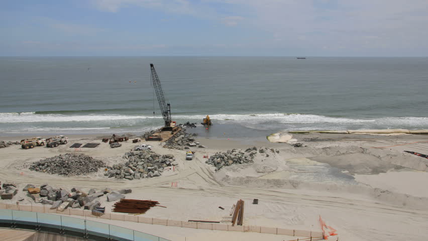 This is a time lapse of construction on the beach, building a new jetty in