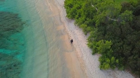 Aerial video shot by a drone of a turquoise sea in Italy. Beautiful beach of the Emerald coast in Sardinia.