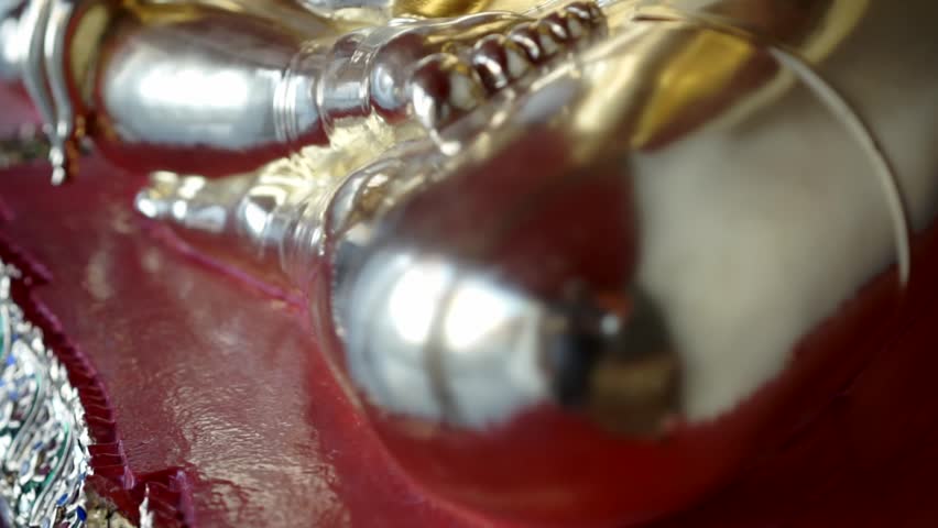 Close up of a sitting  buddhist gold statue