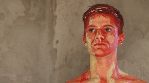 Alive painting of a man. Realistic oil paint body art
