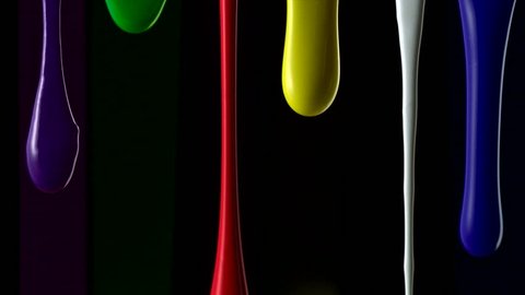 Paint dripping on black background shooting with high speed camera.