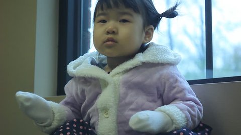 Beautiful East Asian Girl Toddler in Purple Winter Coat