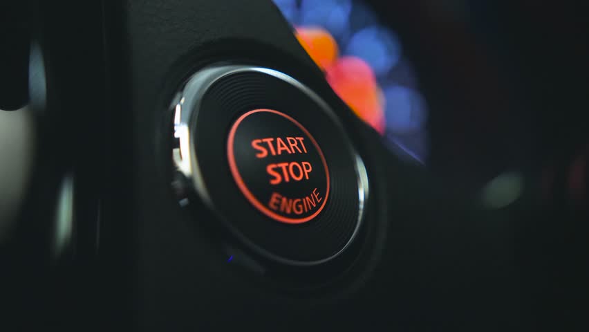 Starting car engine. Track in to the button. Finger press the button to start the car engine.  | Shutterstock HD Video #26768614