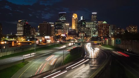 Time lapse video of traffic against the Minneapolis skyline during a busy evening. 4k time lapse, 4096x2304.