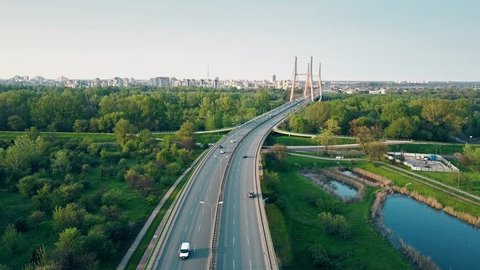 Aerial shot of highway and guyed car bridge in Warsaw. 4K clip