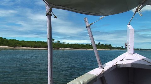 Boat riding along the coast in Bahia, Brazil from the front