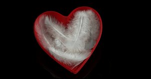 Red Heart and feathers for Saint Valentine's Day, Slow Motion 4K