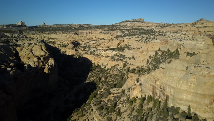 Aerial Eagle Canyon Arch Utah San Rafael desert valley. Geologic landscape sandstone towers, valleys and canyons. Off road all terrain 4x4 vehicles ATV. Dangerous wilderness environment.