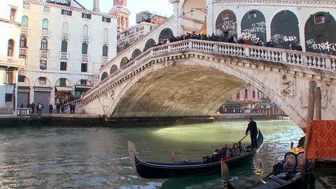 VENICE, ITALY-CIRCA 2011-Time lapse of gondolas under the Rialto Bridge in Venice, Italy.
