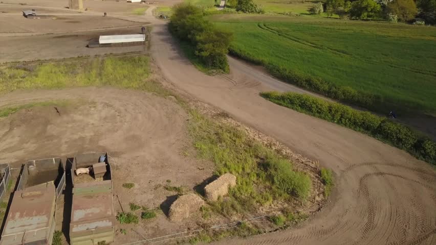 Man and women cycling down a country lane Aerial shot