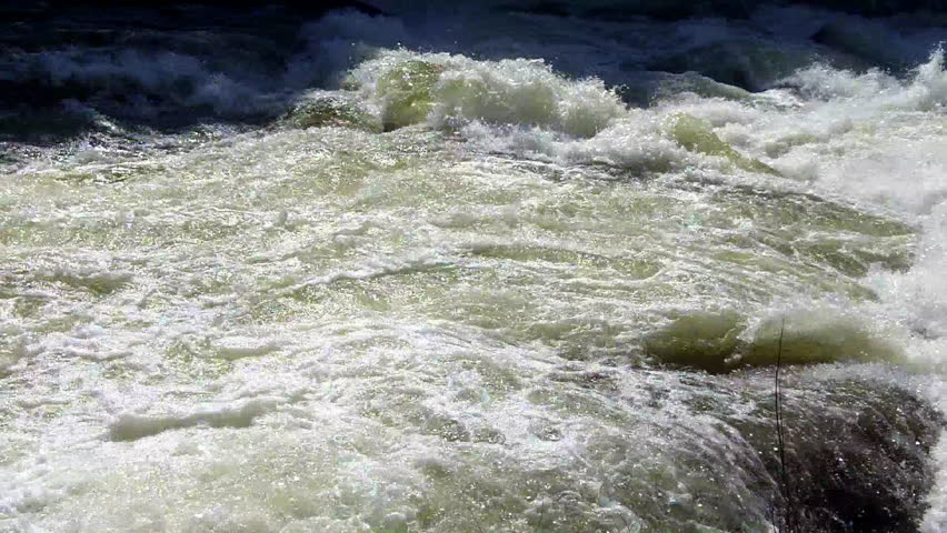 A close up shot of the raging whitewater rapids of the Merced river in Yosemite