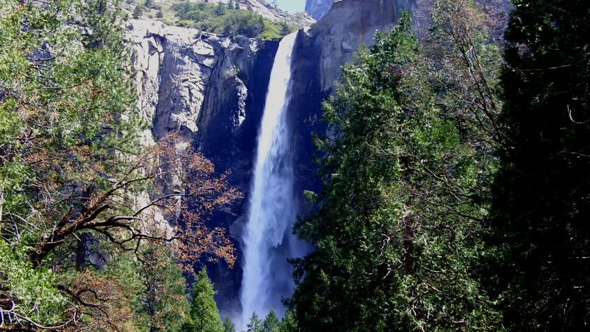 Bridalveil Falls in Yosemite Valley: water plummeting over a high cliff as seen