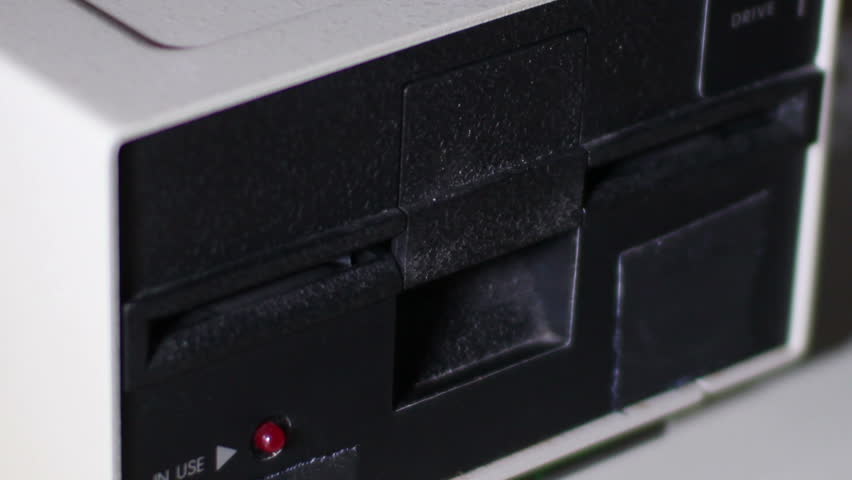Close-up of inserting and removing an old-style 5.25