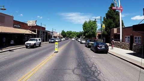 COTTONWOOD, AZ/USA: April 20, 2017- Driving shot through Old Town business district in Cottonwood Arizona. Clip reveals a view from a moving vehicle of the city street and small businesses downtown.