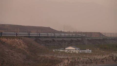 Long Distant Train passes Valley in China, Gansu Province