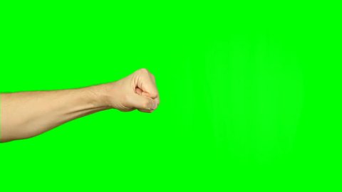 Striking with fist of hand. Kick jab strike on green screen. Boxing martial art buisiness sign victory. Attack fist. Footage contains solid green instead alpha channel, easy keying with any software.