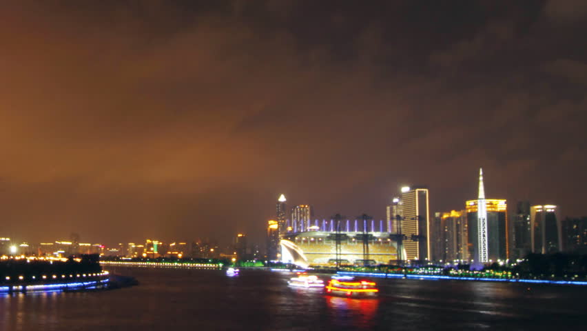 GUANGZHOU - MAY 12: Time lapse of Guangzhou skyline over Pearl River at night on