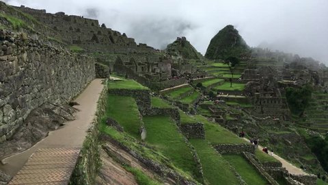 Machu Picchu, the most familiar icon of Inca civilization. Machu Picchu is a 15th-century Inca citadel situated on a mountain ridge above the Sacred Valley northwest of Cuzco, Cusco Region, Peru.