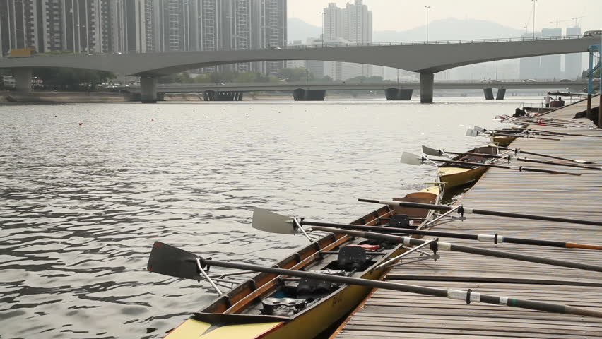 Rowing boats tied to a pier in Hong Kong.