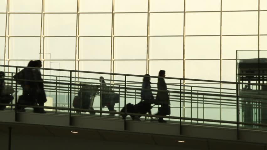 Silhouettes of Travellers in Airport - Hong Kong International Airport Terminal.