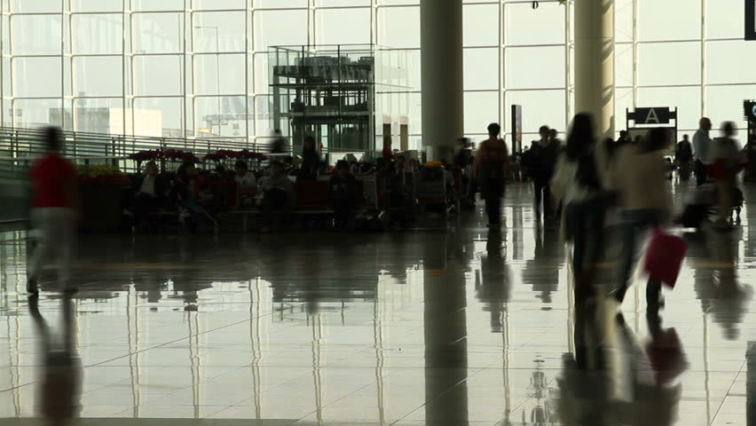 People walking in airport - Hong Kong International Airport Terminal.