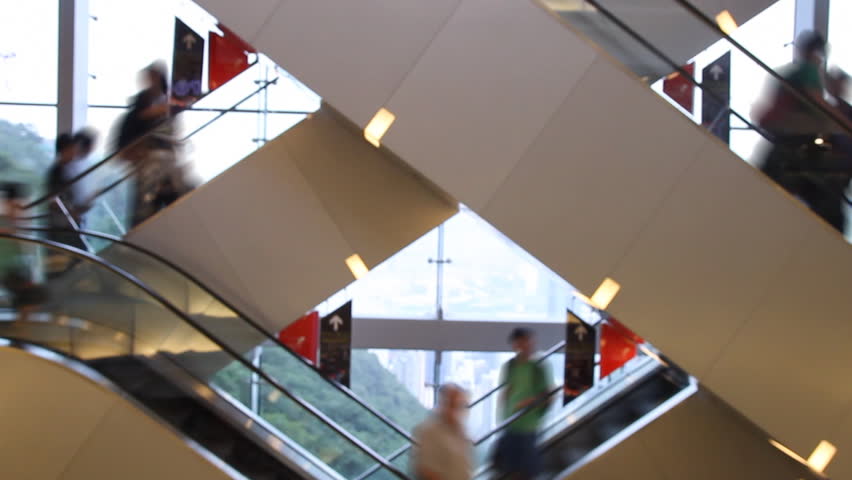 Shopping mall escalator - Time lapse of escalator stairs with crowds of blurred
