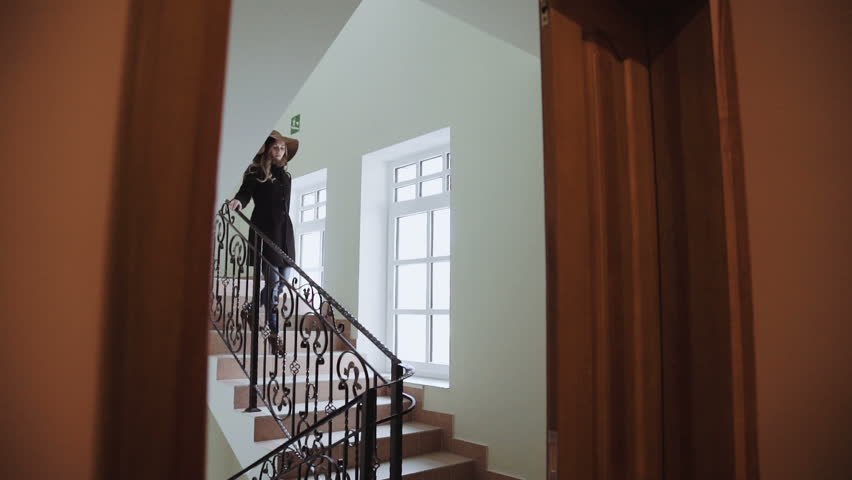 young woman , down the stairs to hotel holiday and vacation
