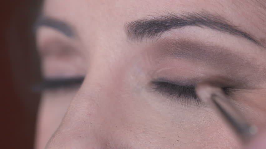 Close up on Shading the eye shadow on the eye | Shutterstock HD Video #26820220